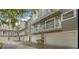 Charming townhome exterior featuring attached garages, balconies, and neutral paint at 507 S Willow Ave, Tampa, FL 33606