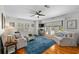 Bright and airy living room with hardwood floors, neutral paint, and a modern ceiling fan at 507 S Willow Ave, Tampa, FL 33606