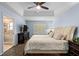 Serene main bedroom with plush carpet, tray ceiling, and ensuite bathroom at 507 S Willow Ave, Tampa, FL 33606