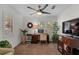 Home office featuring a desk, shelving, great natural light, and neutral carpet at 507 S Willow Ave, Tampa, FL 33606