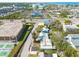 Aerial view of the property near commercial buildings and tennis courts at 508 2Nd St, Indian Rocks Beach, FL 33785