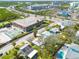 Aerial view of the property showcasing proximity to commercial buildings and tennis courts at 508 2Nd St, Indian Rocks Beach, FL 33785