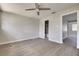 The bedroom includes wood-look flooring, a ceiling fan, and access to an en-suite bathroom at 508 2Nd St, Indian Rocks Beach, FL 33785