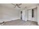 This bedroom offers a ceiling fan and wood-look flooring, plus closet with bifold doors at 508 2Nd St, Indian Rocks Beach, FL 33785