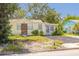 Charming exterior view of the yellow-painted home with a well-maintained front yard at 508 2Nd St, Indian Rocks Beach, FL 33785