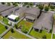 Spacious backyard featuring a well-manicured lawn, lush landscaping, and a screened-in patio at 5239 Fallen Leaf Dr, Riverview, FL 33578