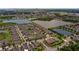 An aerial view of a neighborhood with several ponds and green vegetation at 5239 Fallen Leaf Dr, Riverview, FL 33578