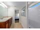 Bright bathroom with double sink vanity, shower, and natural light at 5239 Fallen Leaf Dr, Riverview, FL 33578
