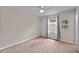 Cozy bedroom with natural light, carpet flooring, a ceiling fan, and a window with curtains at 5239 Fallen Leaf Dr, Riverview, FL 33578