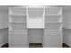 Spacious walk-in closet featuring built-in shelving and drawer storage to maximize organization and convenience at 5239 Fallen Leaf Dr, Riverview, FL 33578