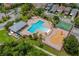 A beautiful community pool and playground area with mature trees and lush landscaping at 5239 Fallen Leaf Dr, Riverview, FL 33578