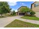 Inviting home features an attached two-car garage and professionally landscaped front yard at 5239 Fallen Leaf Dr, Riverview, FL 33578