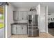 Spacious kitchen showcasing gray cabinets and a stainless steel refrigerator at 5239 Fallen Leaf Dr, Riverview, FL 33578
