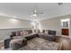 Second floor living area with plush sectional sofa and natural light at 5239 Fallen Leaf Dr, Riverview, FL 33578