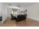 Comfortable living room with wood floors, a ceiling fan, and natural light at 5239 Fallen Leaf Dr, Riverview, FL 33578