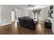 Spacious living room with wood floors and slider door to backyard at 5239 Fallen Leaf Dr, Riverview, FL 33578