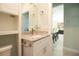 Bright bathroom featuring a granite vanity top, modern fixtures, and a stylish neutral color palette at 5528 40Th N St, St Petersburg, FL 33714
