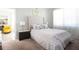 Serene bedroom featuring soft carpet, neutral tones, and a decorative painting adjacent to a sitting room, perfect for relaxation at 5528 40Th N St, St Petersburg, FL 33714
