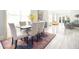 Bright, open dining room with modern furnishings, sleek floors, and large windows offering natural light at 5528 40Th N St, St Petersburg, FL 33714