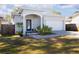 Charming single-story home featuring a well-manicured lawn and a two-car garage with a brick-paved driveway at 5528 40Th N St, St Petersburg, FL 33714