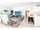 Cozy living room with a flat-screen TV, modern furniture, breakfast bar, and neutral decor creates a relaxing atmosphere at 5528 40Th N St, St Petersburg, FL 33714