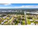 Wide aerial perspective of a tranquil residential area surrounded by lush greenery, providing a peaceful and scenic environment at 5580 S Salford Blvd, North Port, FL 34287