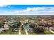 Overhead shot of homes surrounded by trees, showcasing a well-planned neighborhood layout on a clear day at 5580 S Salford Blvd, North Port, FL 34287