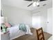 Comfortable bedroom with soft carpet and a ceiling fan, providing a cozy retreat for rest and relaxation at 5580 S Salford Blvd, North Port, FL 34287