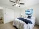 This bedroom features a bed with decorative pillows, large closet and stylish artwork at 5580 S Salford Blvd, North Port, FL 34287