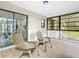 Relaxing covered patio with comfortable seating, ideal for enjoying outdoor views and peaceful moments at 5580 S Salford Blvd, North Port, FL 34287