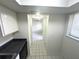 Hallway with tile flooring leading to the rest of the home at 6342 Newtown Cir # A4, Tampa, FL 33615