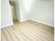 A spacious bedroom boasts light, wood-look flooring and fresh, neutral paint throughout at 6344 Newtown Cir # B2, Tampa, FL 33615