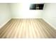 A spacious bedroom boasts light, wood-look flooring and fresh, neutral paint throughout at 6344 Newtown Cir # B2, Tampa, FL 33615