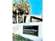 A welcoming entrance to North Bay Village Condominiums with lush palms and clear blue skies at 6344 Newtown Cir # B2, Tampa, FL 33615
