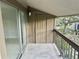 Private patio with sliding glass doors to the interior and views of mature landscaping at 6344 Newtown Cir # B2, Tampa, FL 33615