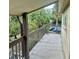 Private outdoor patio overlooking lush greenery and a well-maintained community at 6344 Newtown Cir # B2, Tampa, FL 33615