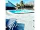 Community swimming pool with lounge chairs and well-maintained surrounding area at 6344 Newtown Cir # B2, Tampa, FL 33615