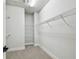 Walk-in closet featuring carpeted flooring and wire shelving for optimized storage space at 6605 N Nebraska Ave # 23, Tampa, FL 33604
