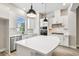Spacious kitchen features stainless steel appliances and a breakfast bar island at 6605 N Nebraska Ave # 23, Tampa, FL 33604