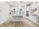 Bright kitchen with white cabinets, stainless steel appliances, and a center island at 6605 N Nebraska Ave # 23, Tampa, FL 33604