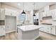 Updated kitchen features a large island and stainless steel appliances at 6605 N Nebraska Ave # 23, Tampa, FL 33604