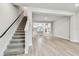 Open-concept living space with staircase that flows seamlessly into the modern kitchen at 6605 N Nebraska Ave # 23, Tampa, FL 33604