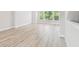 Bright, airy living room with large windows and light wood floors at 6605 N Nebraska Ave # 23, Tampa, FL 33604
