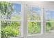 Three windows offering a natural view of trees and greenery at 6605 N Nebraska Ave # 23, Tampa, FL 33604