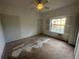 Spacious bedroom featuring a ceiling fan and natural light from the window at 8158 Eagles Park N Dr, St Petersburg, FL 33709