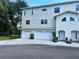 Well-maintained two-story home featuring a multi-car garage and inviting front entrances at 8158 Eagles Park N Dr, St Petersburg, FL 33709
