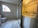 Cozy laundry room featuring a toilet and washer and dryer at 8158 Eagles Park N Dr, St Petersburg, FL 33709