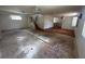 Open concept living room with stairs leading to the second floor, and multiple windows for natural light at 8158 Eagles Park N Dr, St Petersburg, FL 33709