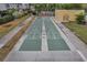 Shuffleboard courts between a pond and complex, offers a fun recreational activity at 8158 Eagles Park N Dr, St Petersburg, FL 33709