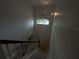 Bright staircase leading up with a view from the window at 8158 Eagles Park N Dr, St Petersburg, FL 33709